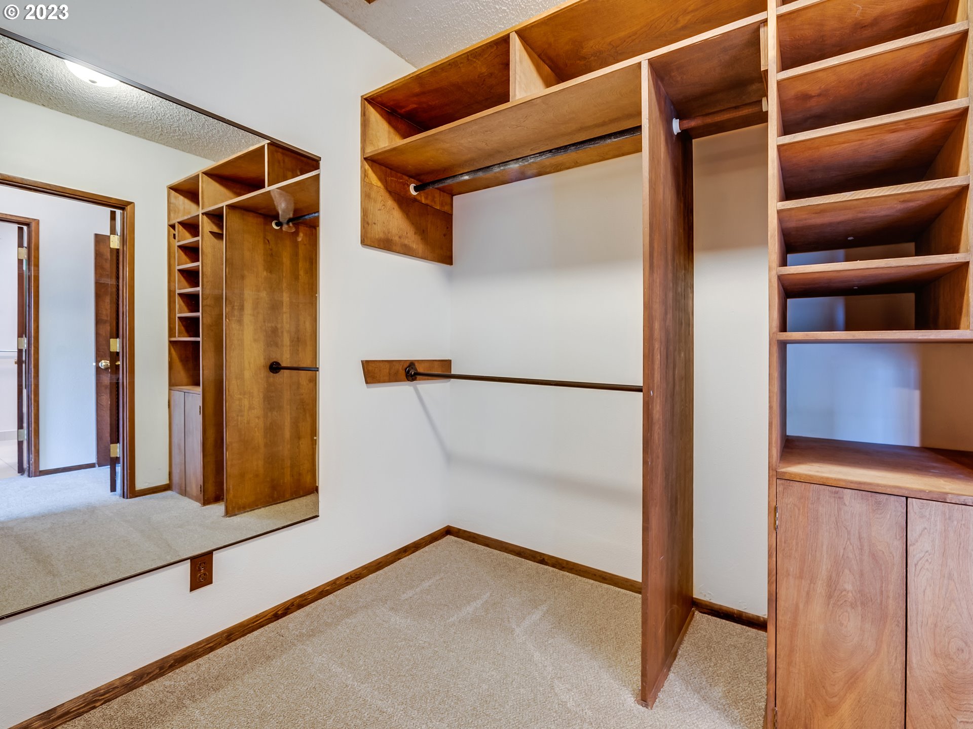 176 West C Street Springfield, OR 97477 - Photo 25 of 42 a view of walk in closet with empty racks