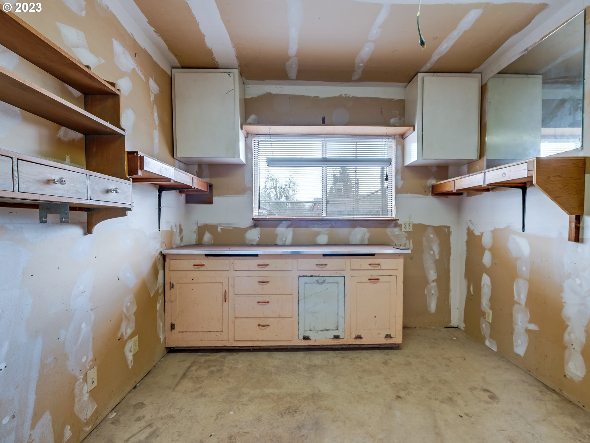 176 West C Street Springfield, OR 97477 - Photo 35 of 42 a kitchen with white cabinets and sink