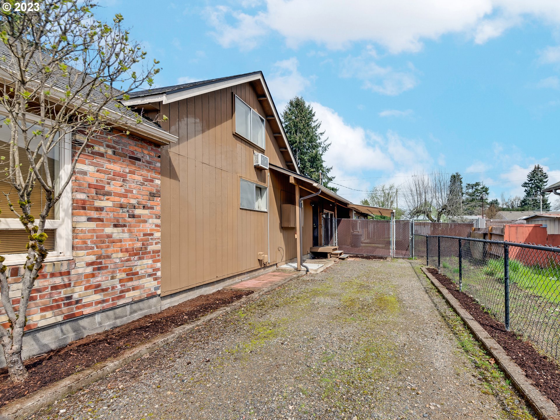 176 West C Street Springfield, OR 97477 - Photo 42 of 42 a view of a house with a wooden fence