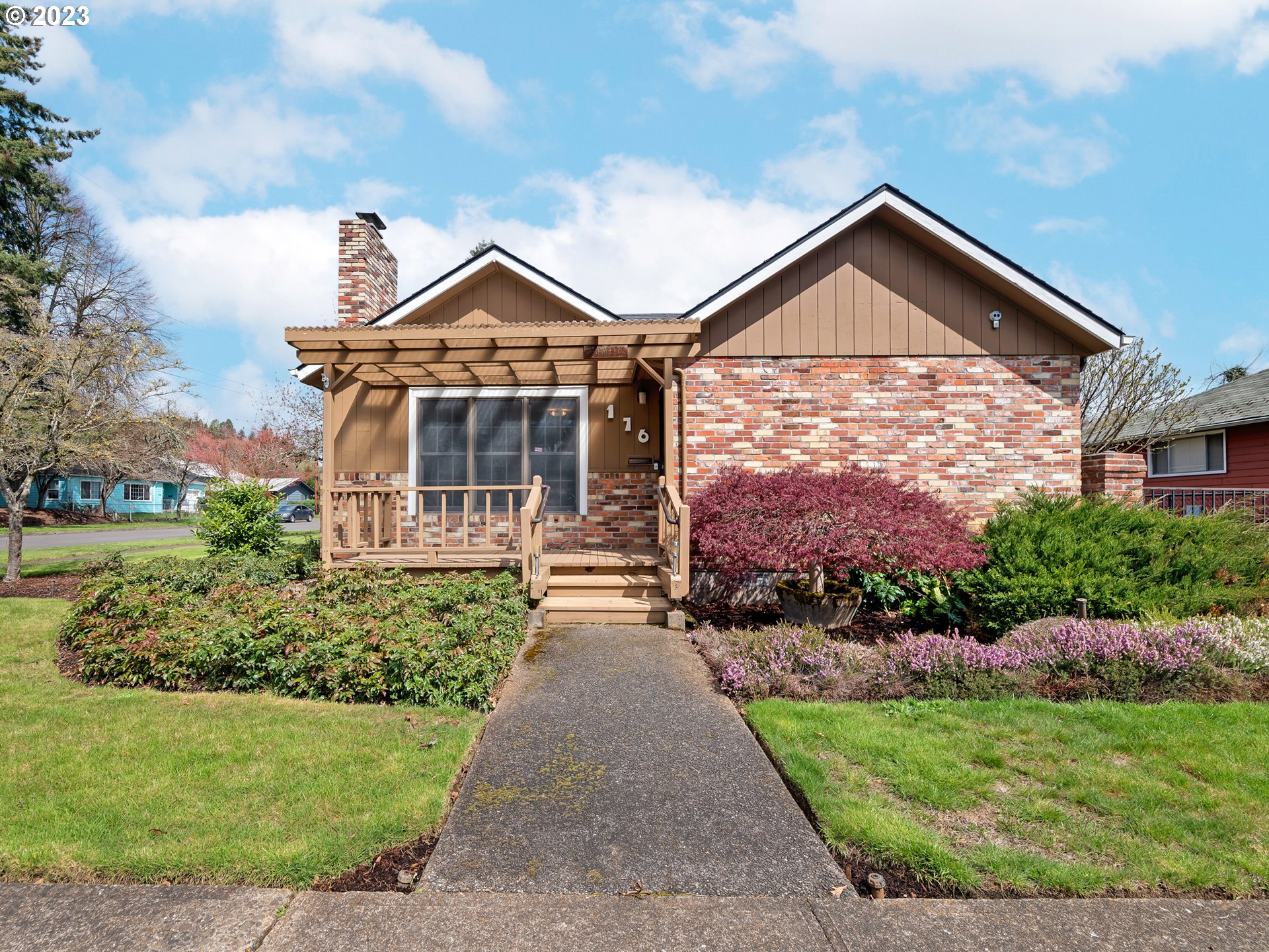 176 West C Street Springfield, OR 97477 - Photo 6 of 42 a front view of a house with a yard