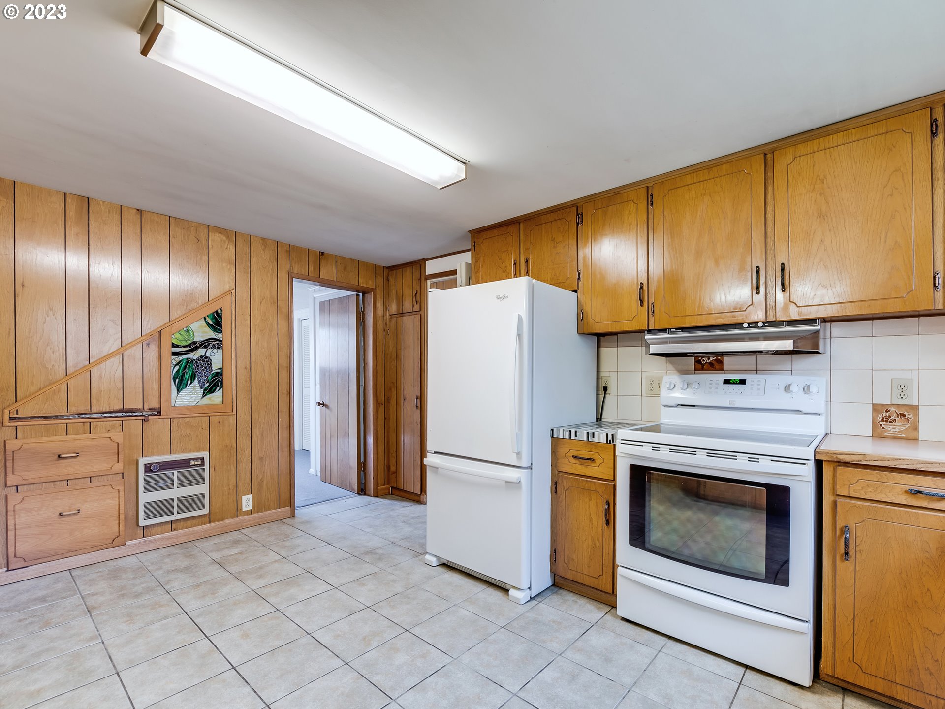 176 West C Street Springfield, OR 97477 - Photo 10 of 42 a kitchen with stainless steel appliances granite countertop a refrigerator a stove and a sink