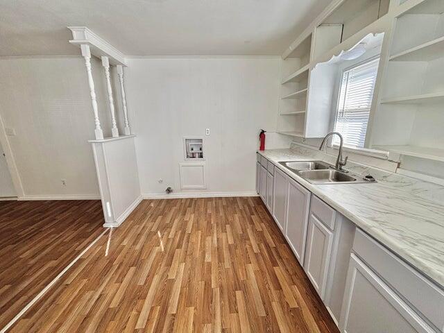 420 West Lynn Street Slaton, TX 79364 - Photo 13 of 25 a kitchen with sink and refrigerator