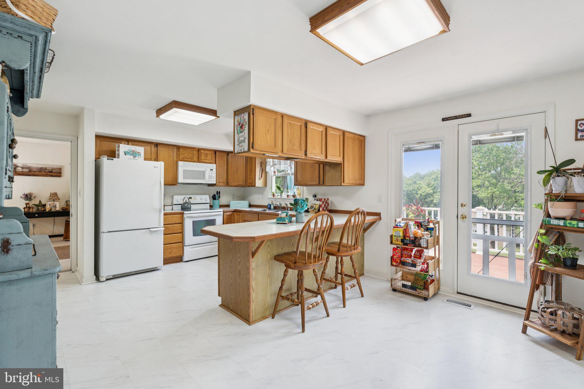 1039 Mountain View Road Fredericksburg, VA 22406 - Photo 9 of 49 Bright & cheery kitchen w luxury vinyl tile floors