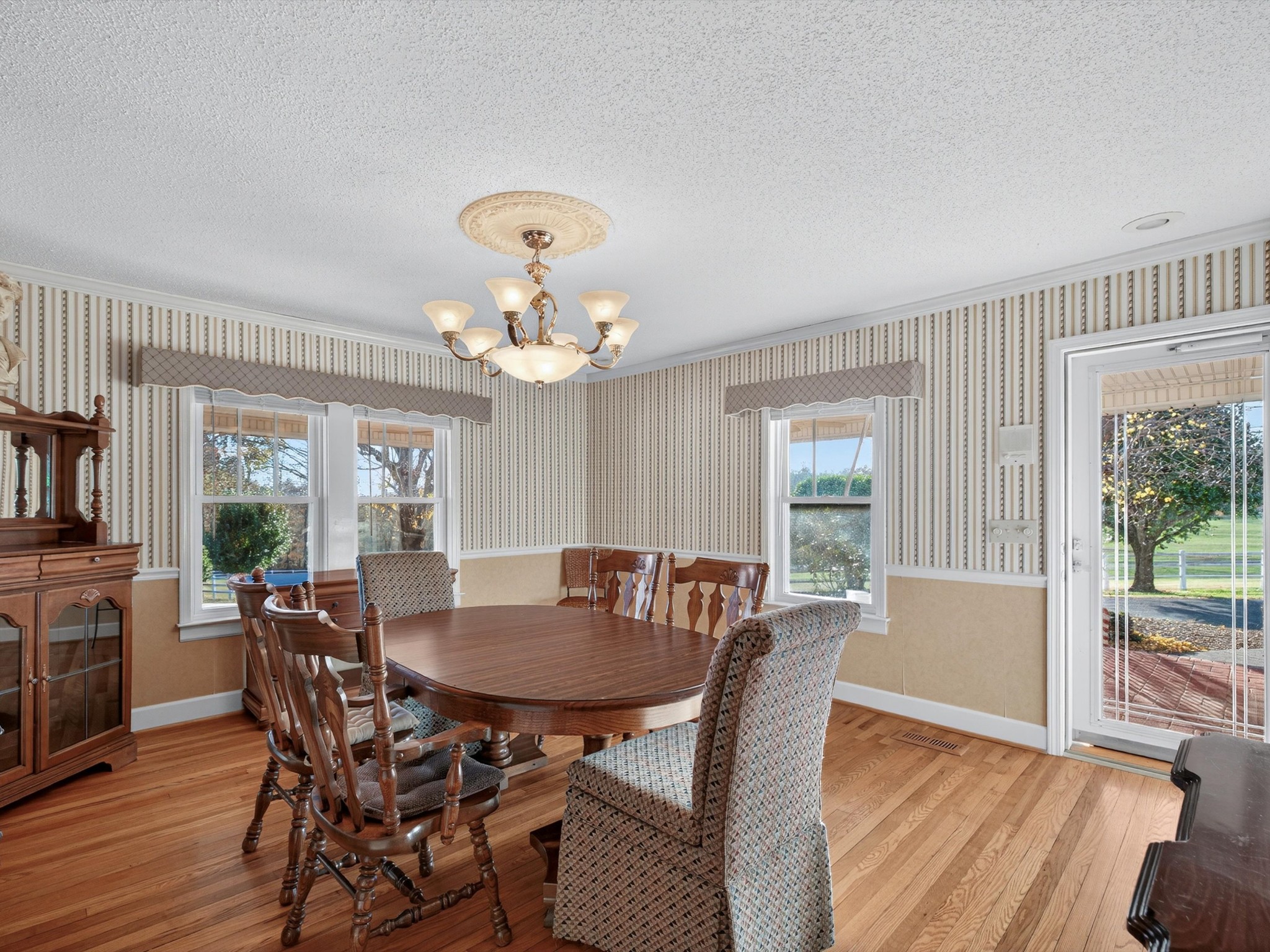 275 Swift Lane Cunningham, TN 37052 - Photo 19 of 67 a view of a dining room with furniture wooden floor and a chandelier
