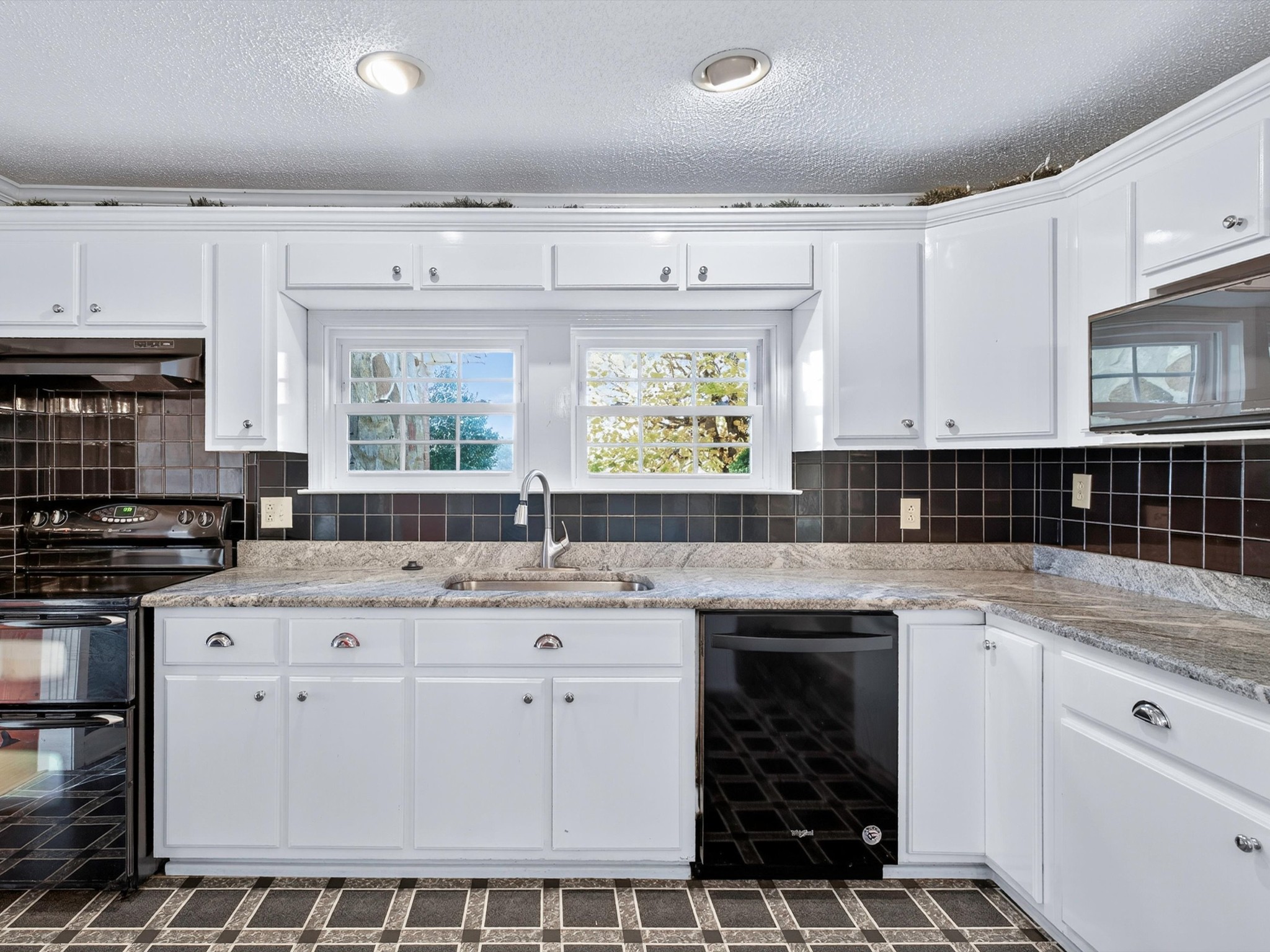 275 Swift Lane Cunningham, TN 37052 - Photo 23 of 67 a kitchen with a sink stove and cabinets