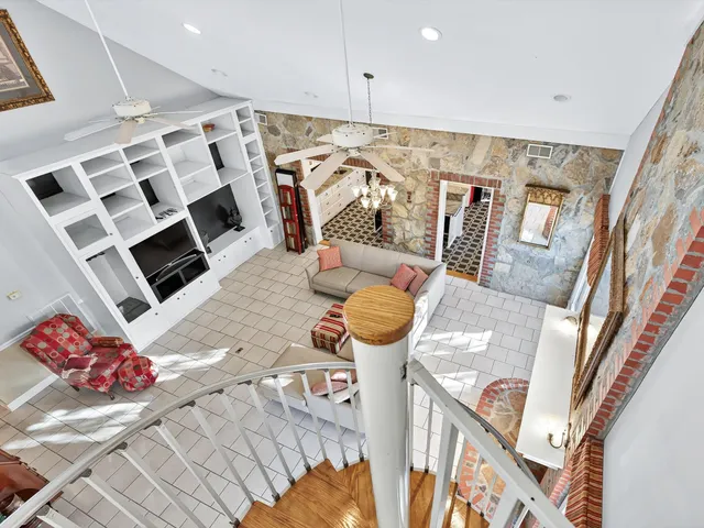 a view of walk in closet with wooden floor