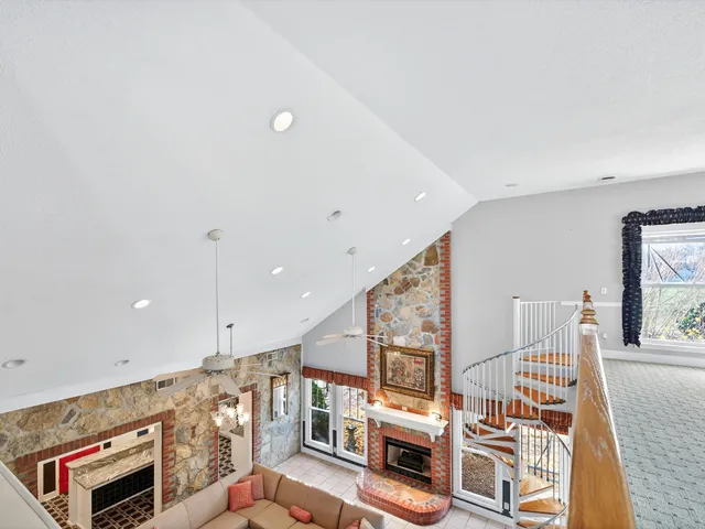 a bathroom with a granite countertop toilet a sink and mirror