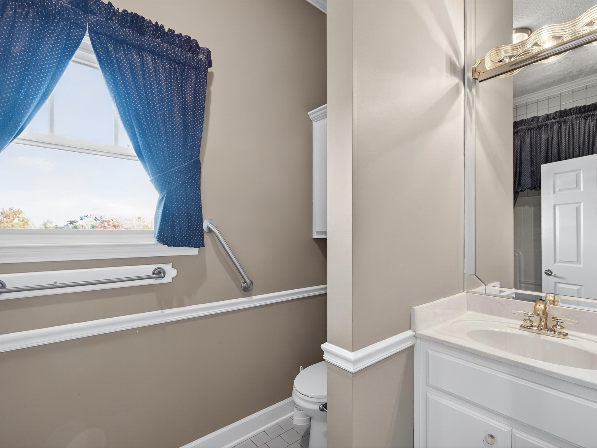 275 Swift Lane Cunningham, TN 37052 - Photo 52 of 67 a bathroom with a sink a toilet and vanity