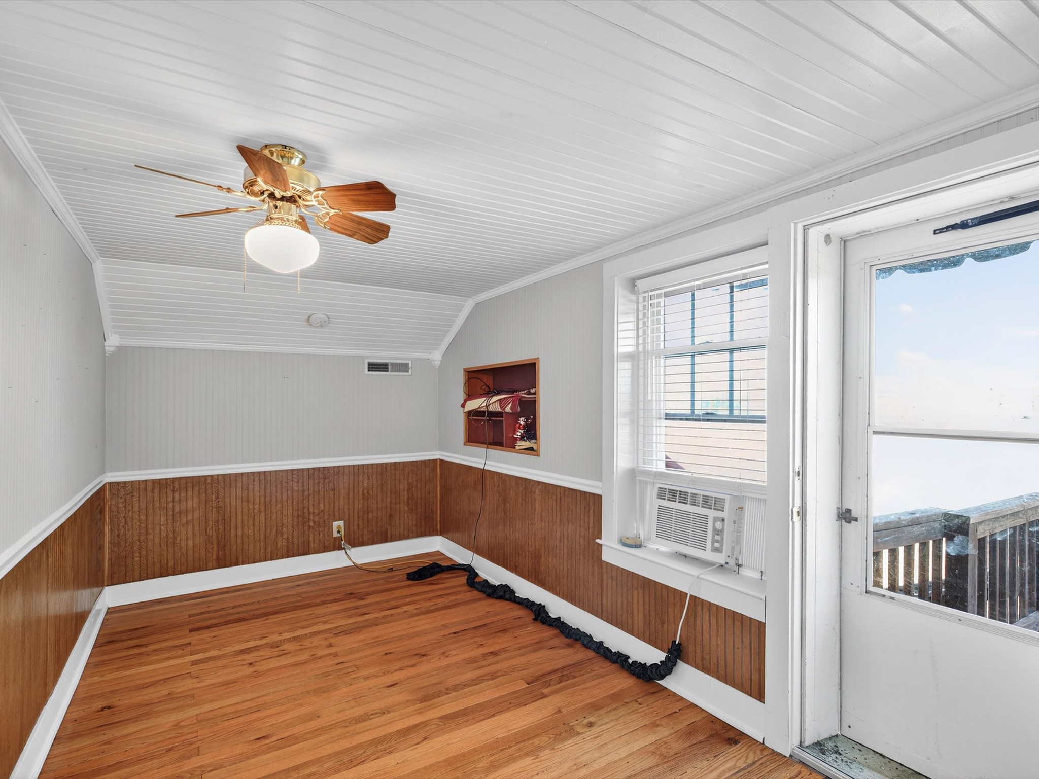 275 Swift Lane Cunningham, TN 37052 - Photo 61 of 67 an empty room with wooden floor and fan