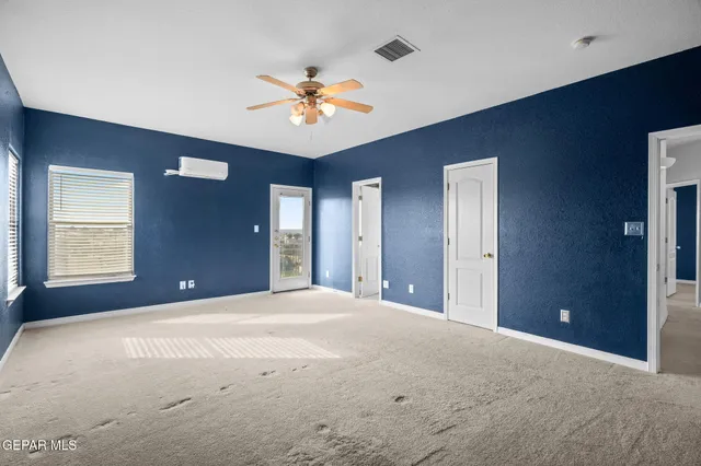 a en suite bathroom with a sink and a large mirror