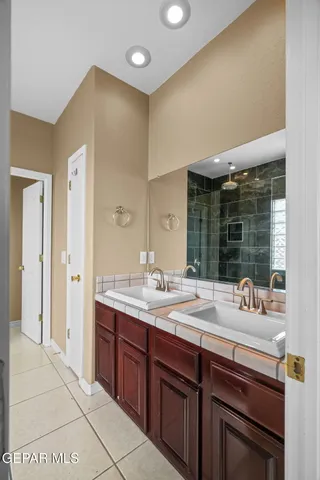 a bathroom with a glass door shower