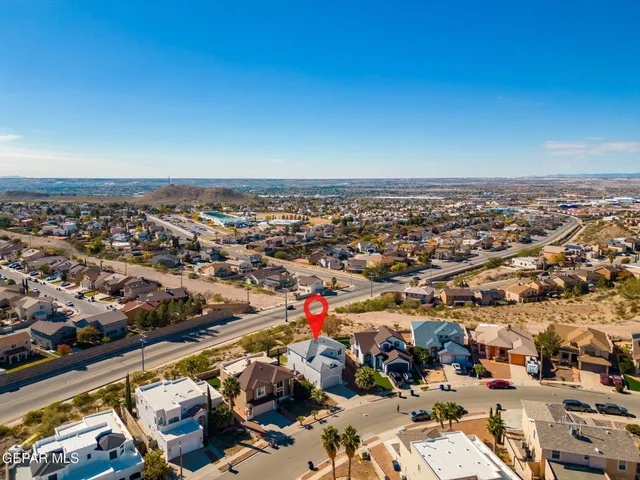 an aerial view of residential houses with outdoor space