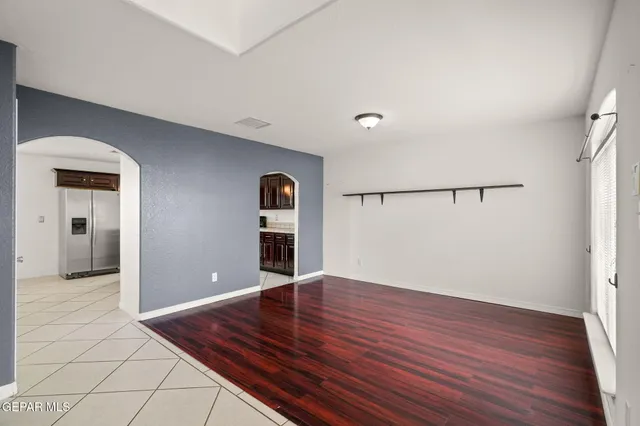 a view of a room with wooden floor