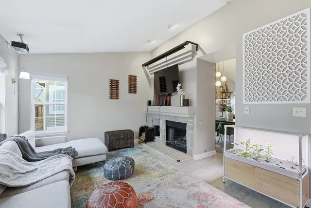 a living room with furniture or couch and a fireplace