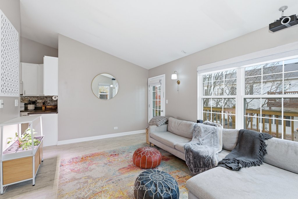 2460 Golf Ridge Circle, Unit 2460 Naperville, IL 60563 - Photo 15 of 25 a living room with furniture and a window