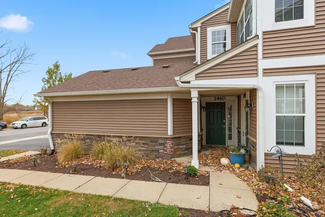 a front view of a house with yard