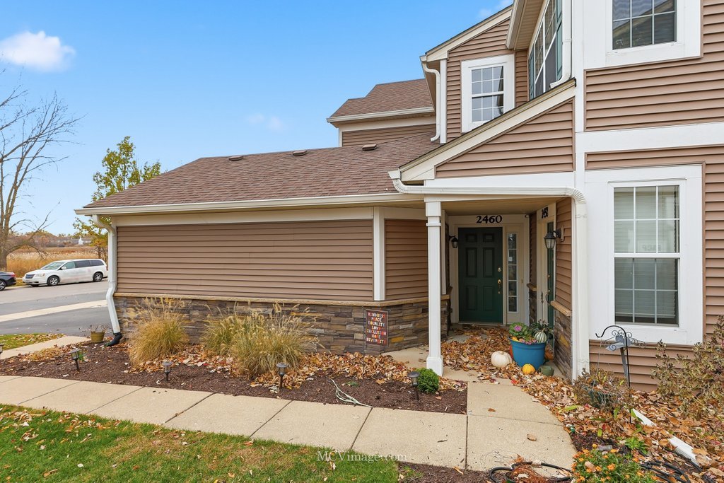 2460 Golf Ridge Circle, Unit 2460 Naperville, IL 60563 - Photo 5 of 25 a front view of a house with yard