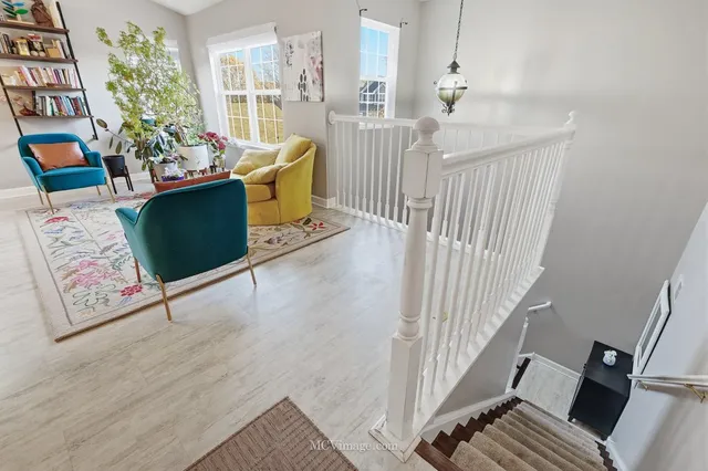 a view of a hallway with furniture and toys