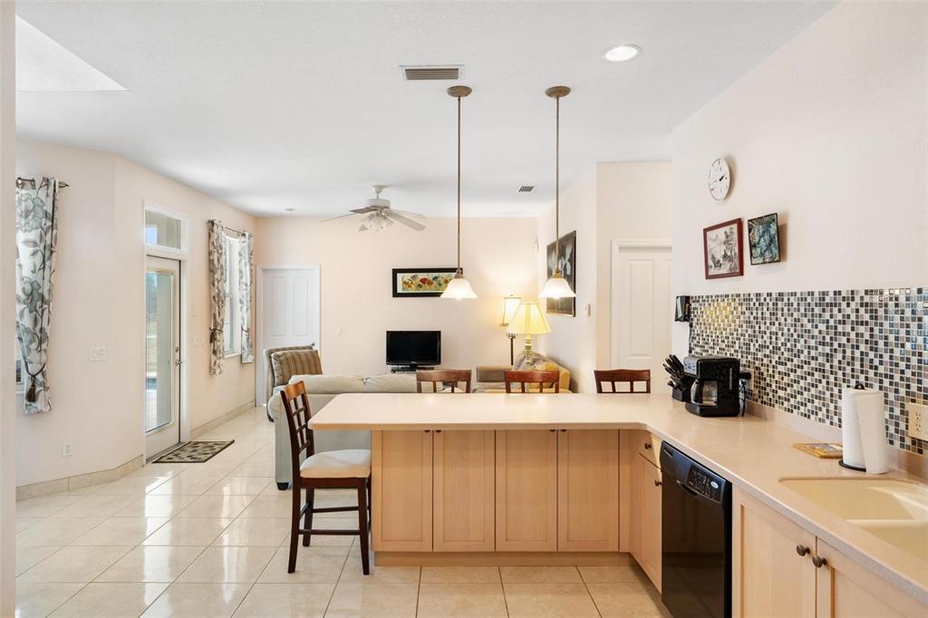 8069 Southwest Aviary Road Arcadia, FL 34269 - Photo 18 of 60 a kitchen with a sink a stove a refrigerator and white cabinets