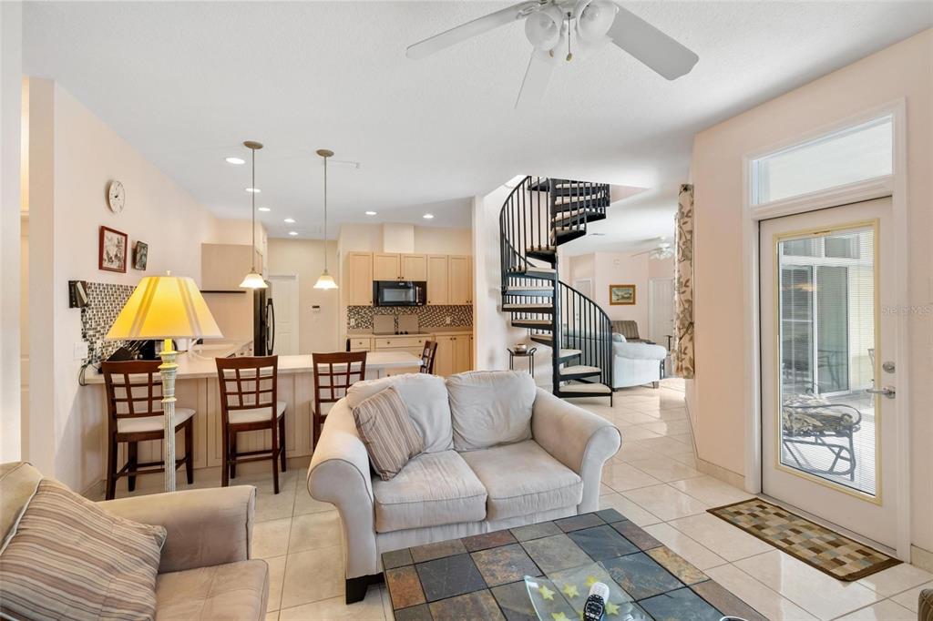 8069 Southwest Aviary Road Arcadia, FL 34269 - Photo 20 of 60 a living room with furniture and a chandelier