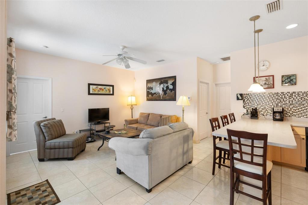8069 Southwest Aviary Road Arcadia, FL 34269 - Photo 21 of 60 a living room with furniture and a wooden floor