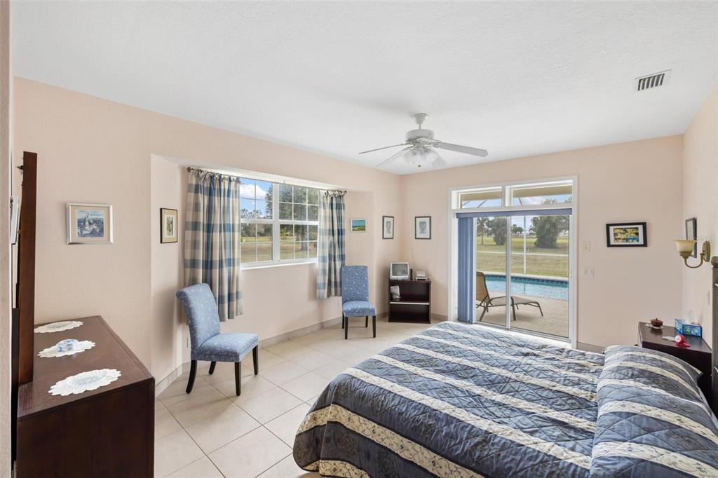 8069 Southwest Aviary Road Arcadia, FL 34269 - Photo 24 of 60 a bedroom with a bed and a window