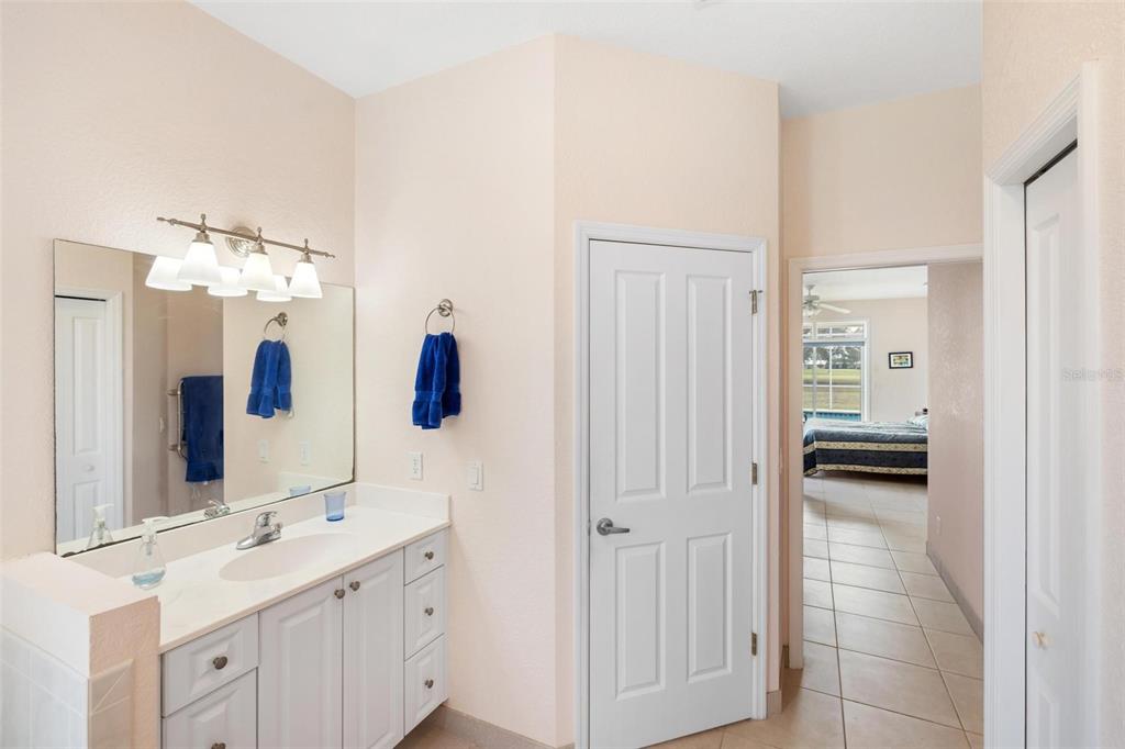 8069 Southwest Aviary Road Arcadia, FL 34269 - Photo 29 of 60 a bathroom with a sink and a mirror