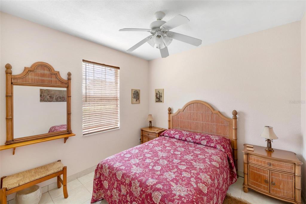 8069 Southwest Aviary Road Arcadia, FL 34269 - Photo 36 of 60 a bedroom with a bed dresser and a window