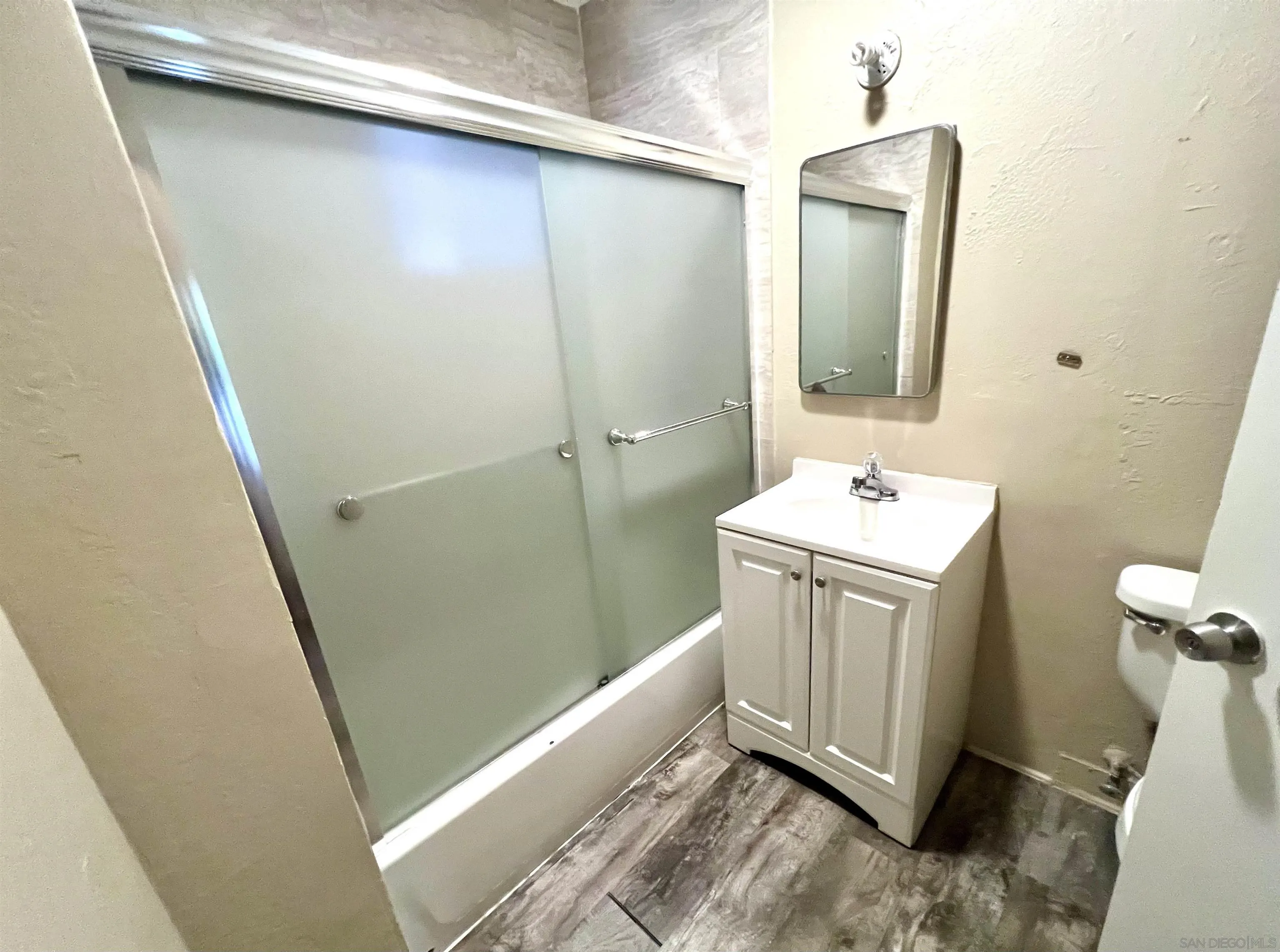 32500 Rincon Ranch Road Pauma Valley, CA 92061 - Photo 7 of 19 a bathroom with a sink a toilet and mirror