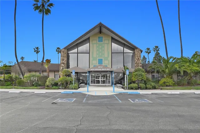 a view of pool with a house