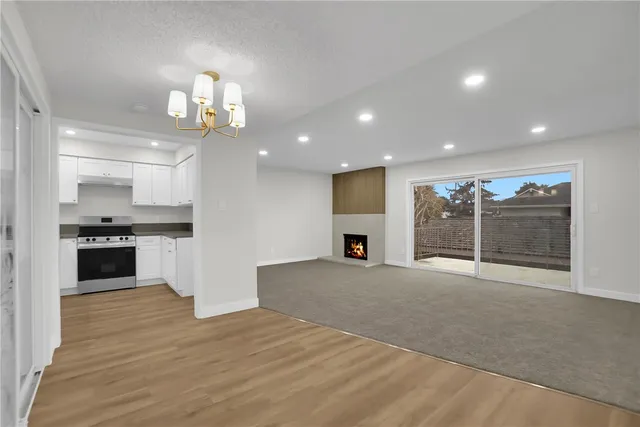 a view of a kitchen with a sink and cabinets