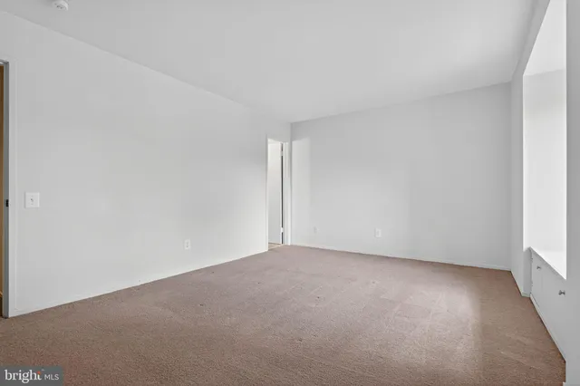 a view of an empty room and window
