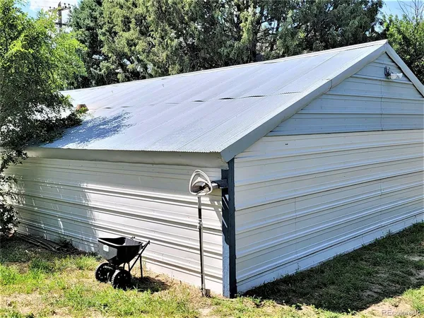 a view of wooden bench in backyard