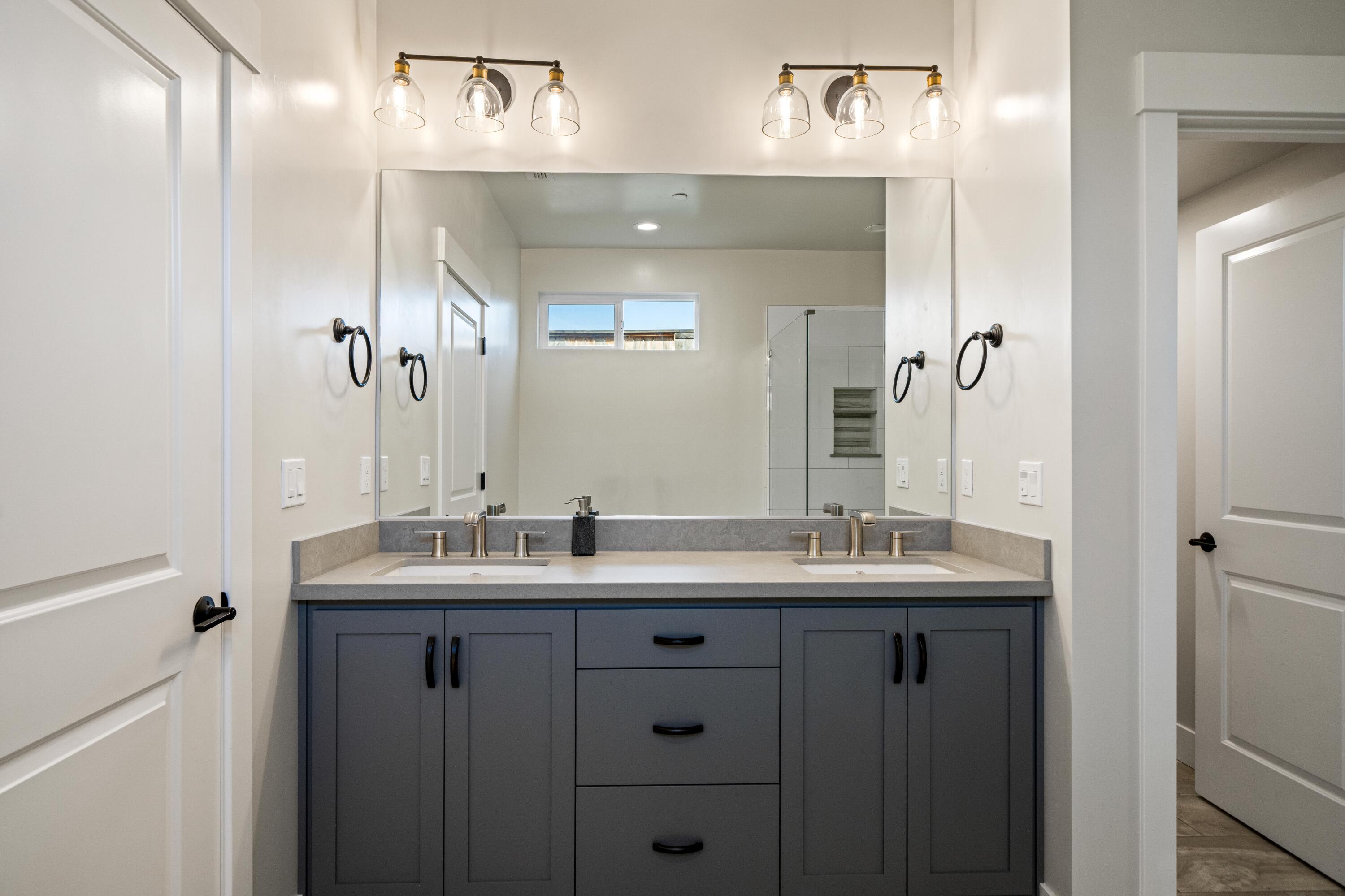 3001 Luke Trail Redding, CA 96002 - Photo 15 of 43 a bathroom with a double vanity sink and a mirror