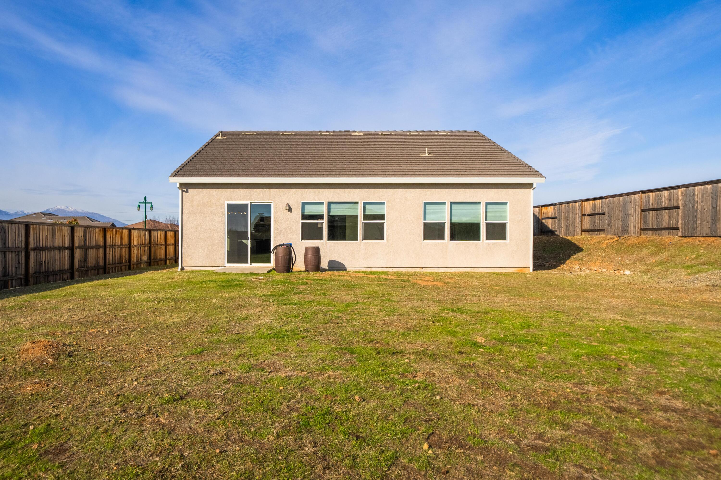 3001 Luke Trail Redding, CA 96002 - Photo 27 of 43 a view of a house with backyard and balcony