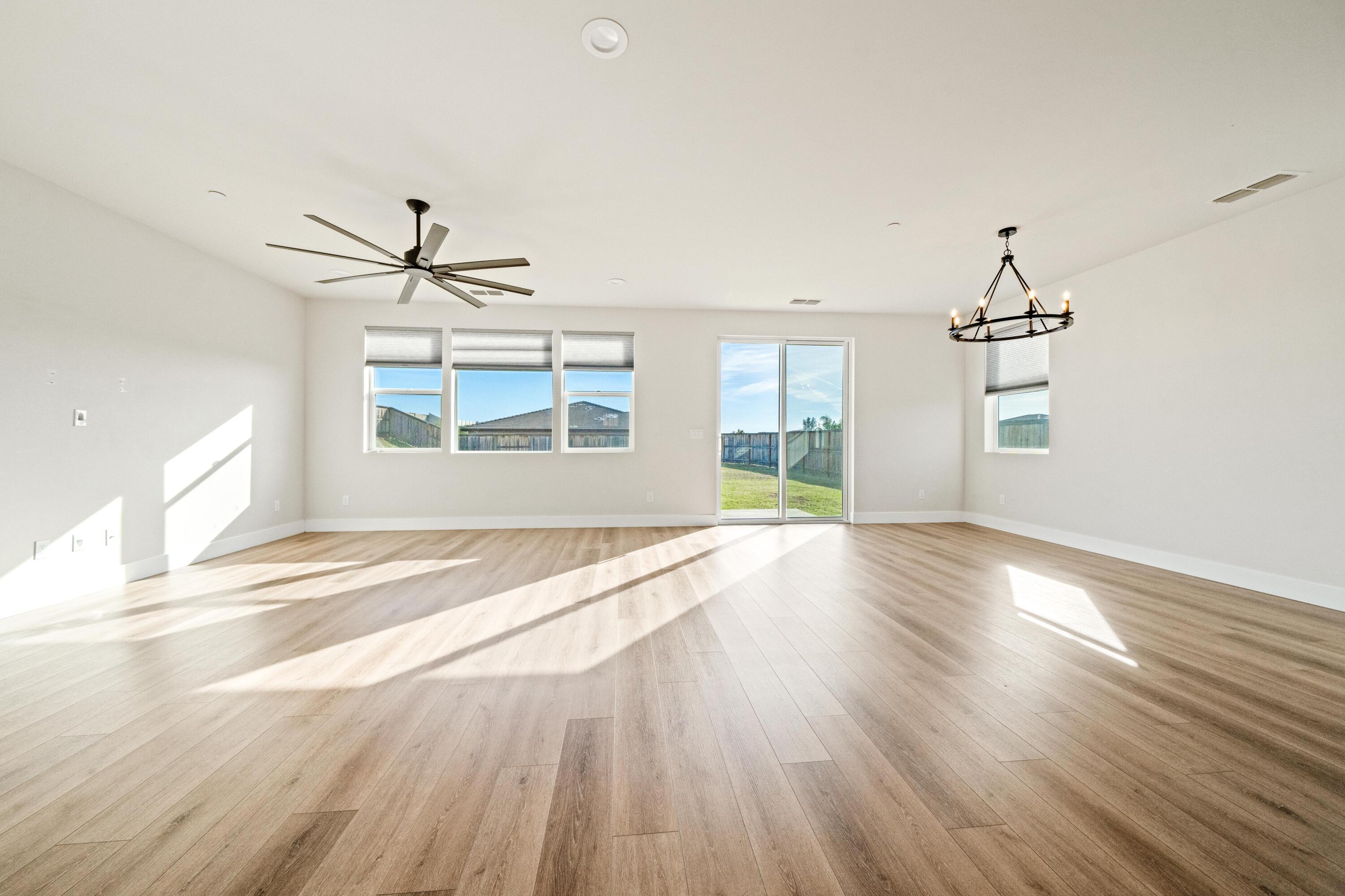 3001 Luke Trail Redding, CA 96002 - Photo 6 of 43 wooden floor in an empty room with a window