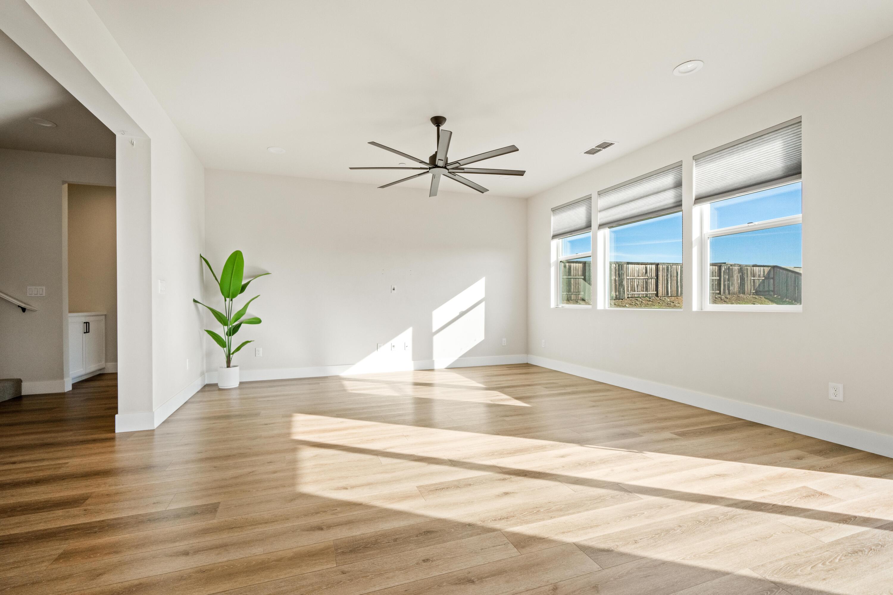 3001 Luke Trail Redding, CA 96002 - Photo 7 of 43 a view of an empty room with window and wooden floor