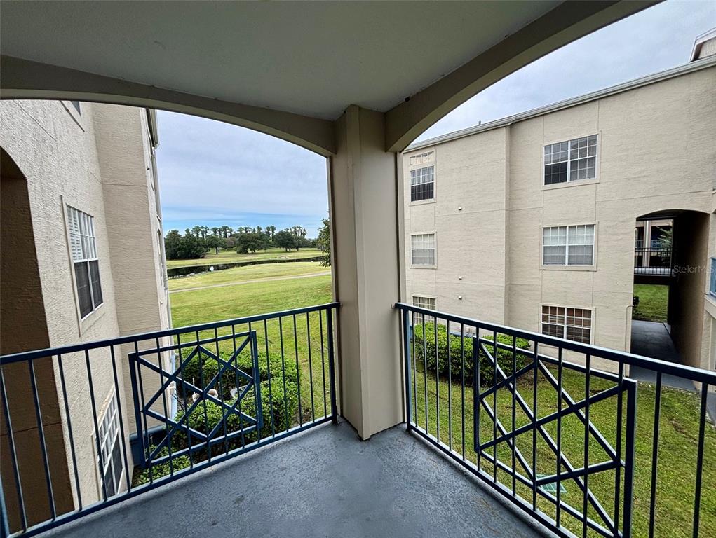 7320 Westpointe Boulevard, Unit 526 Orlando, FL 32835 - Photo 14 of 20 a view of city with balcony