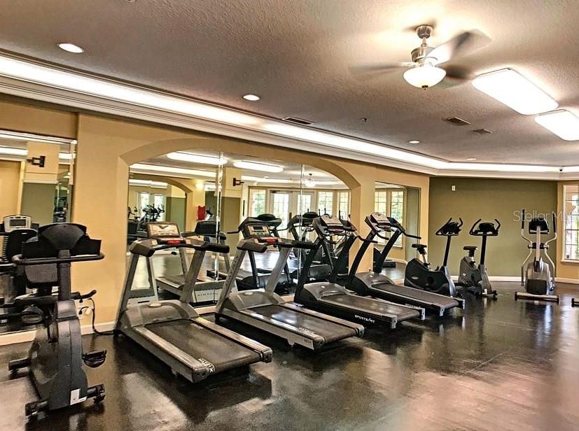 7320 Westpointe Boulevard, Unit 526 Orlando, FL 32835 - Photo 16 of 20 a view of a room with gym equipment