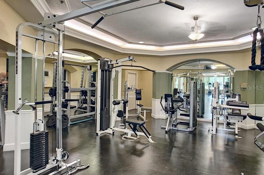 7320 Westpointe Boulevard, Unit 526 Orlando, FL 32835 - Photo 17 of 20 a view of a room with lots of gym equipment