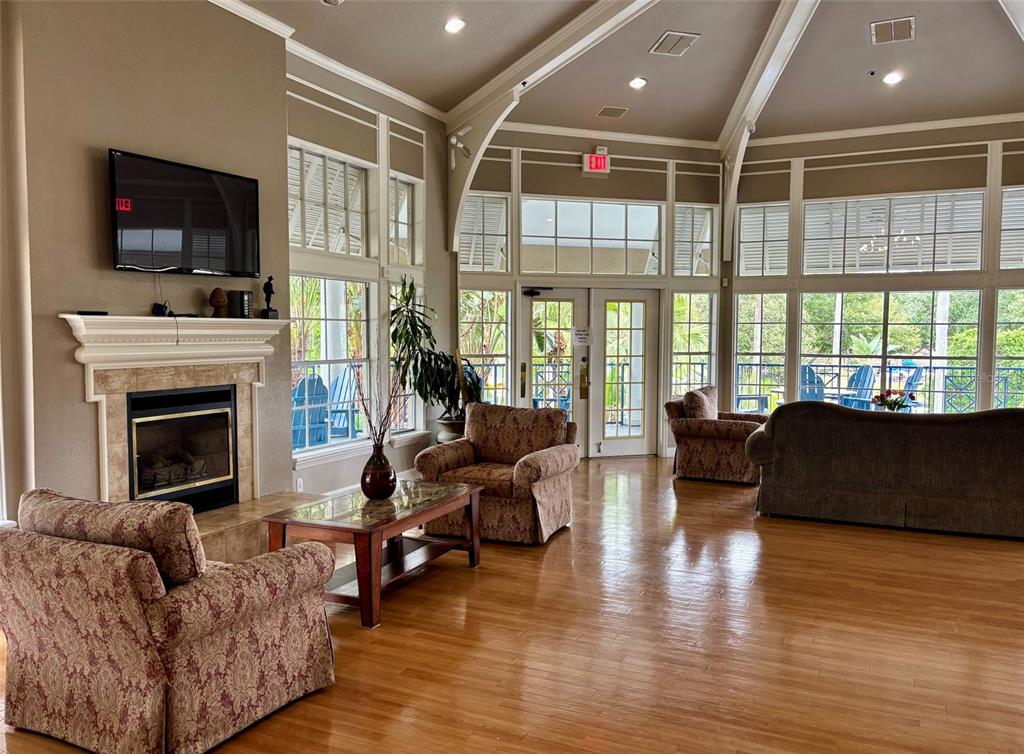 7320 Westpointe Boulevard, Unit 526 Orlando, FL 32835 - Photo 18 of 20 a living room with fireplace furniture and a flat screen tv