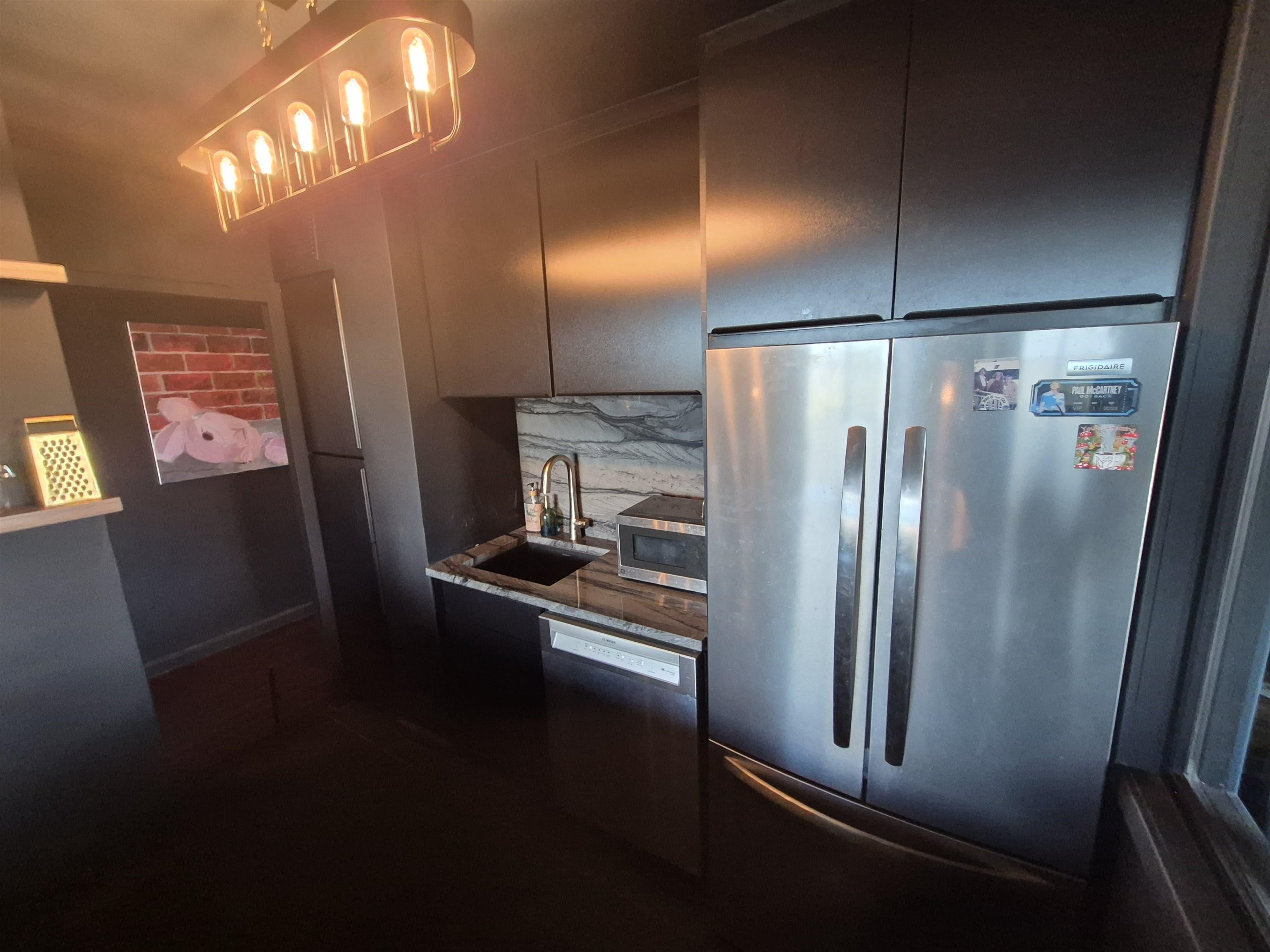 6040 Boulevard East, Unit 6B West New York, NJ 07093 - Photo 19 of 32 a kitchen with stainless steel appliances refrigerator and stove