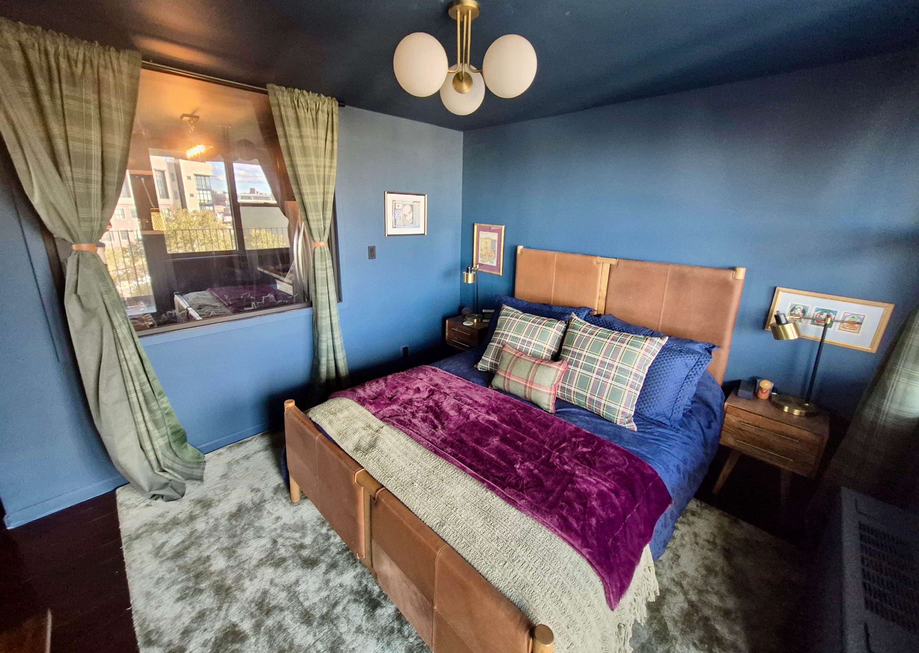 6040 Boulevard East, Unit 6B West New York, NJ 07093 - Photo 21 of 32 a bed sitting in a bedroom next to a window