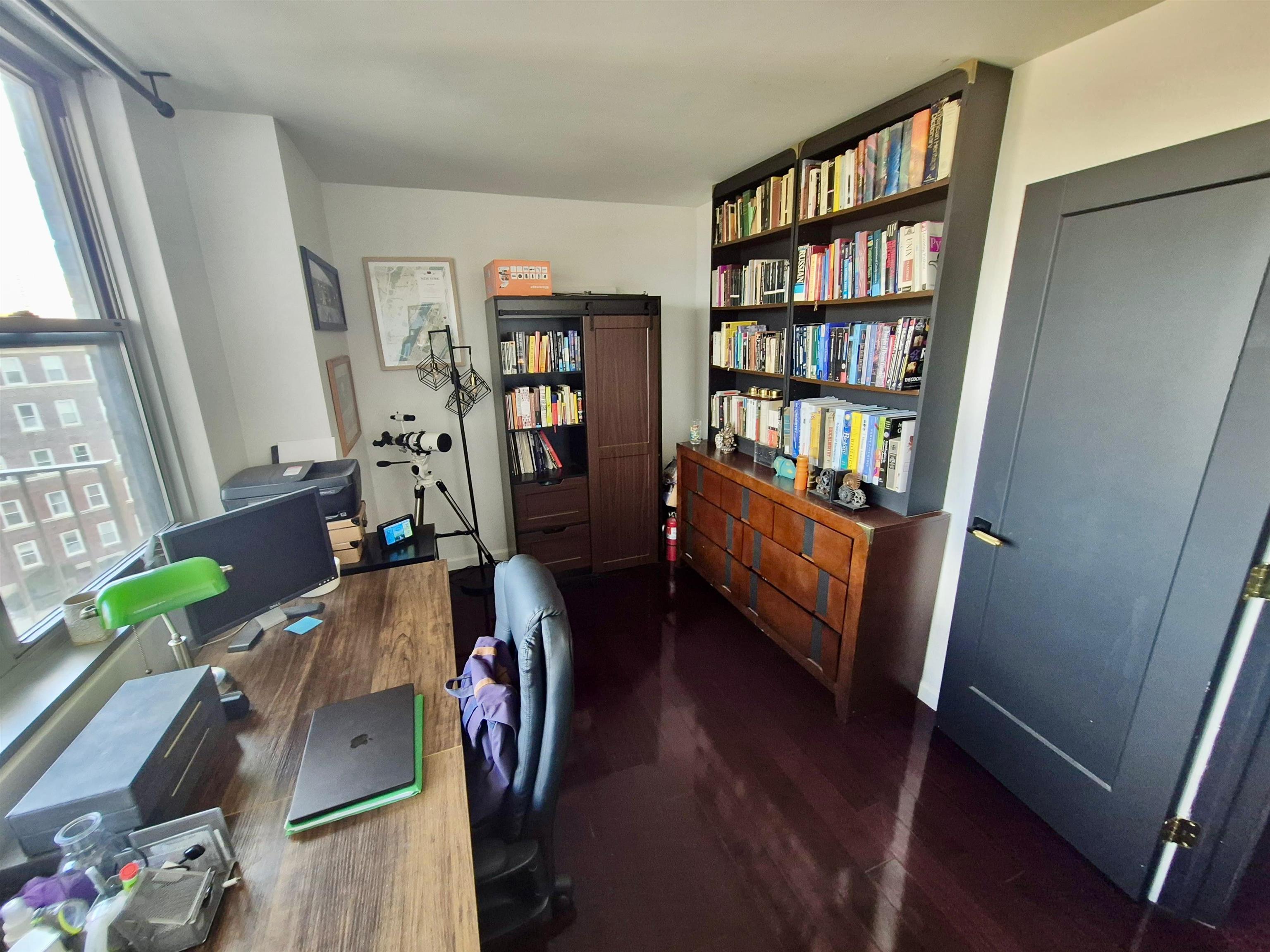 6040 Boulevard East, Unit 6B West New York, NJ 07093 - Photo 23 of 32 a view of a workspace with furniture and wooden floor