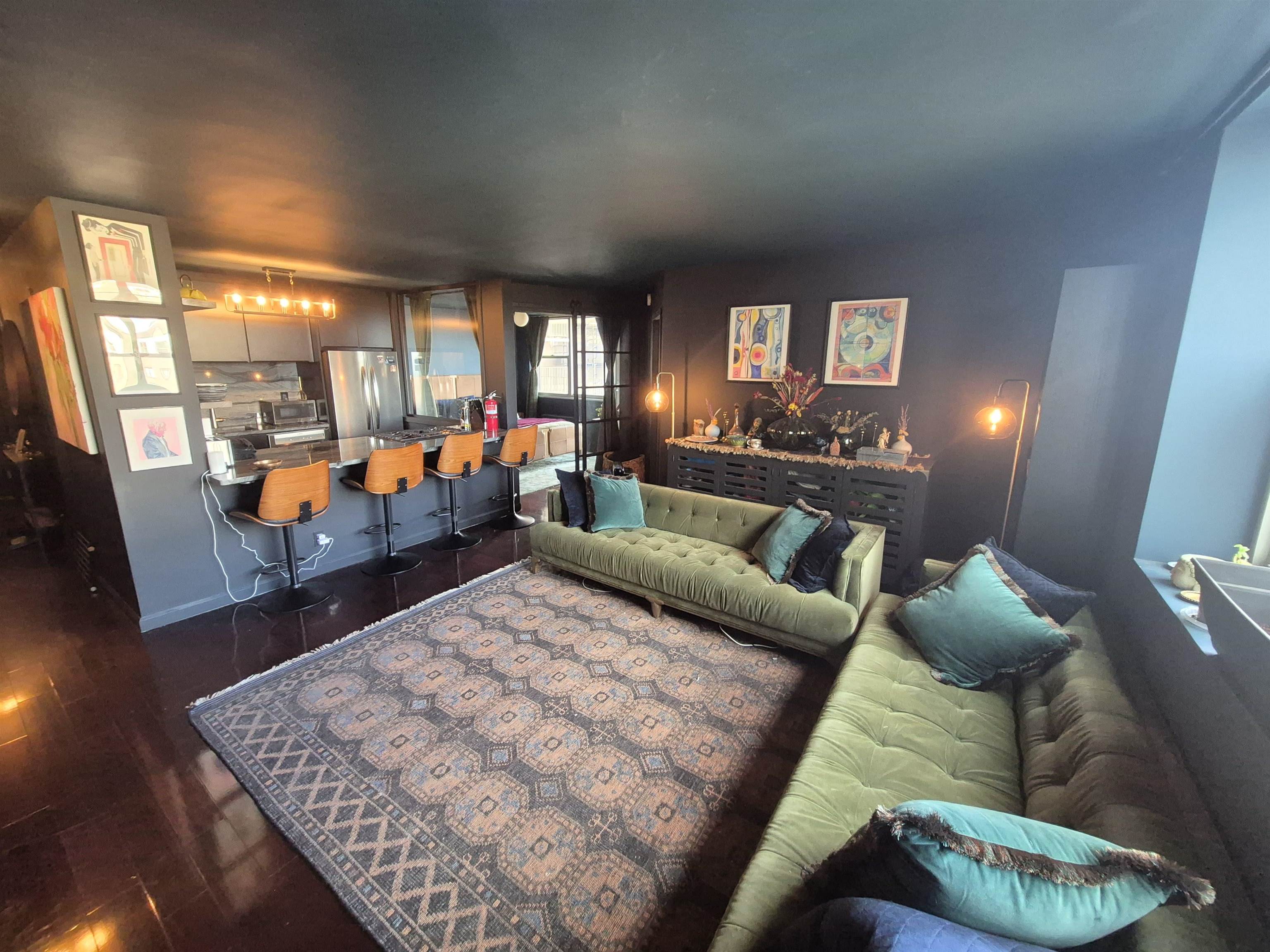 6040 Boulevard East, Unit 6B West New York, NJ 07093 - Photo 32 of 32 a living room with furniture and a large window