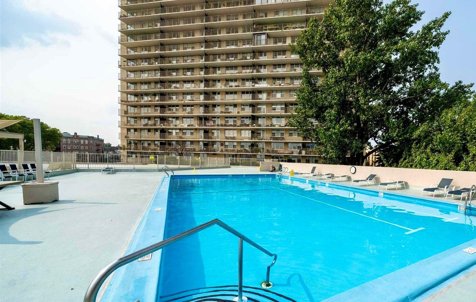 6040 Boulevard East, Unit 6B West New York, NJ 07093 - Photo 5 of 32 a view of a swimming pool with a patio
