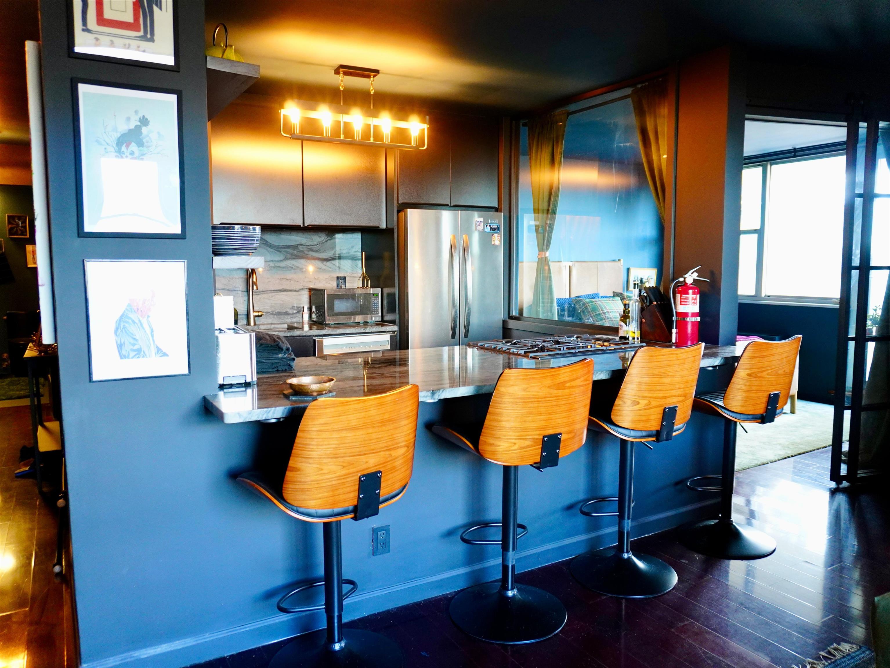 6040 Boulevard East, Unit 6B West New York, NJ 07093 - Photo 8 of 32 a view of living room with furniture and lamp