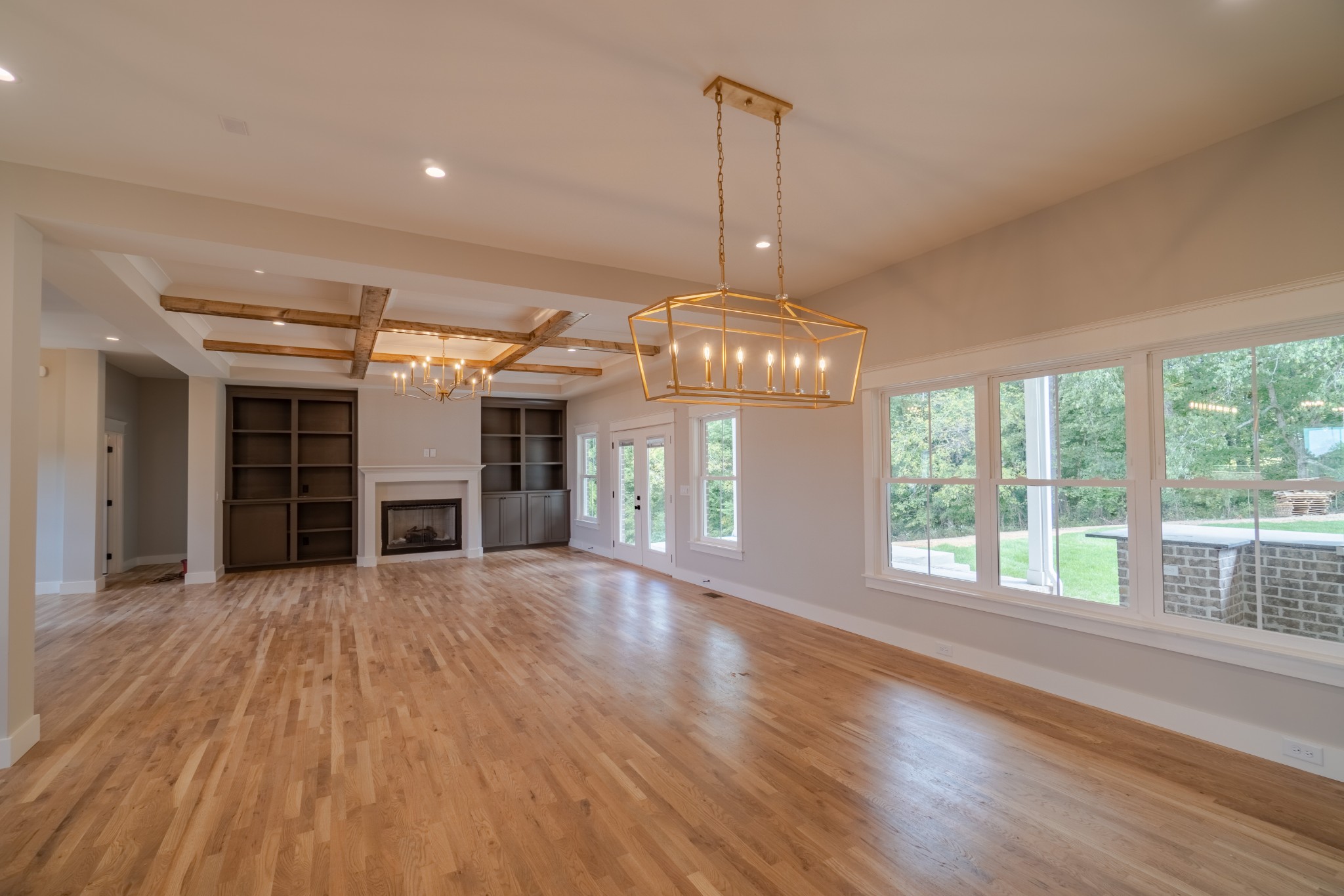 7039 Hall Road Greenbrier, TN 37073 - Photo 12 of 73 a view of a room with wooden floor fireplace and windows