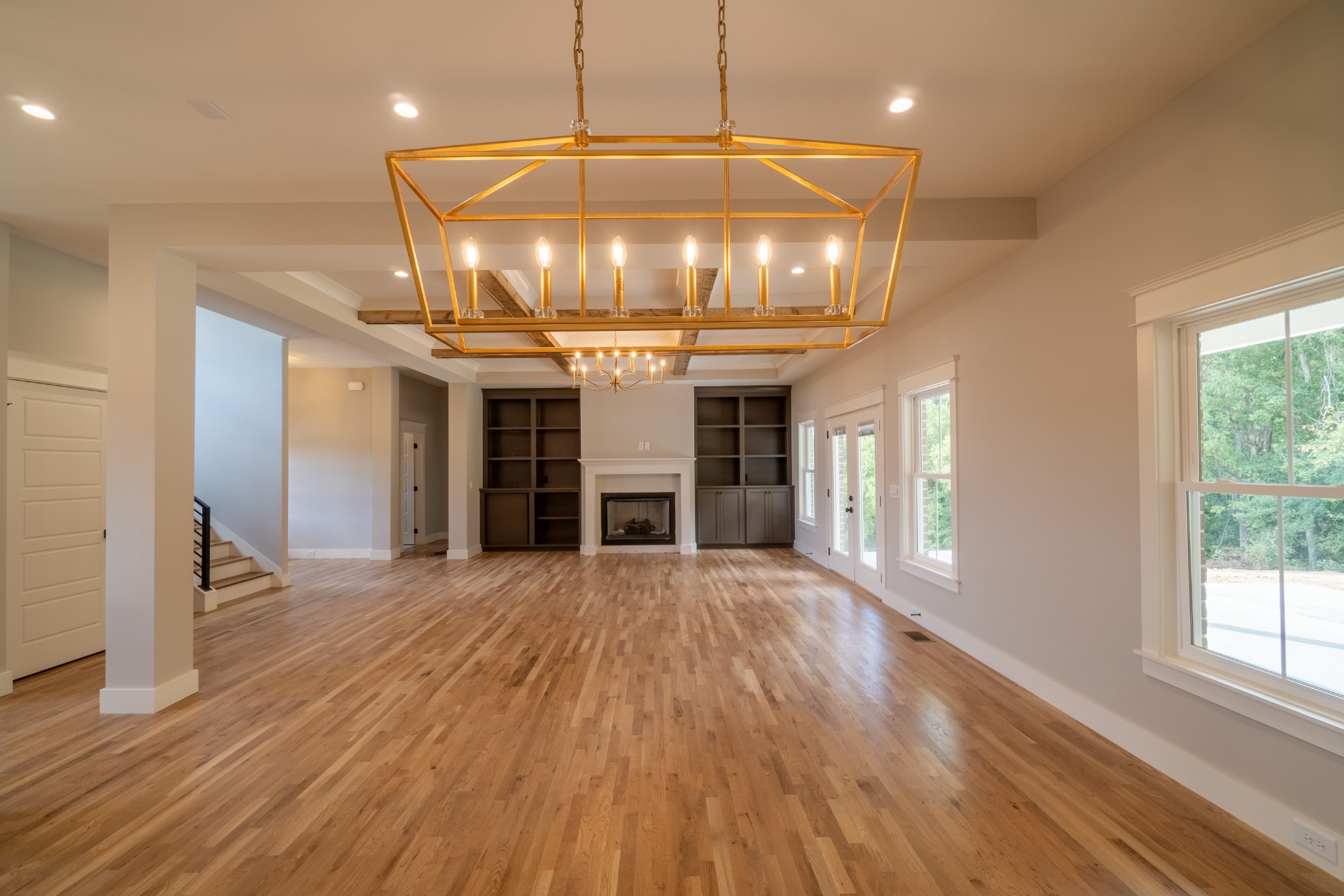 7039 Hall Road Greenbrier, TN 37073 - Photo 13 of 73 a view of a room with wooden floor chandelier and windows