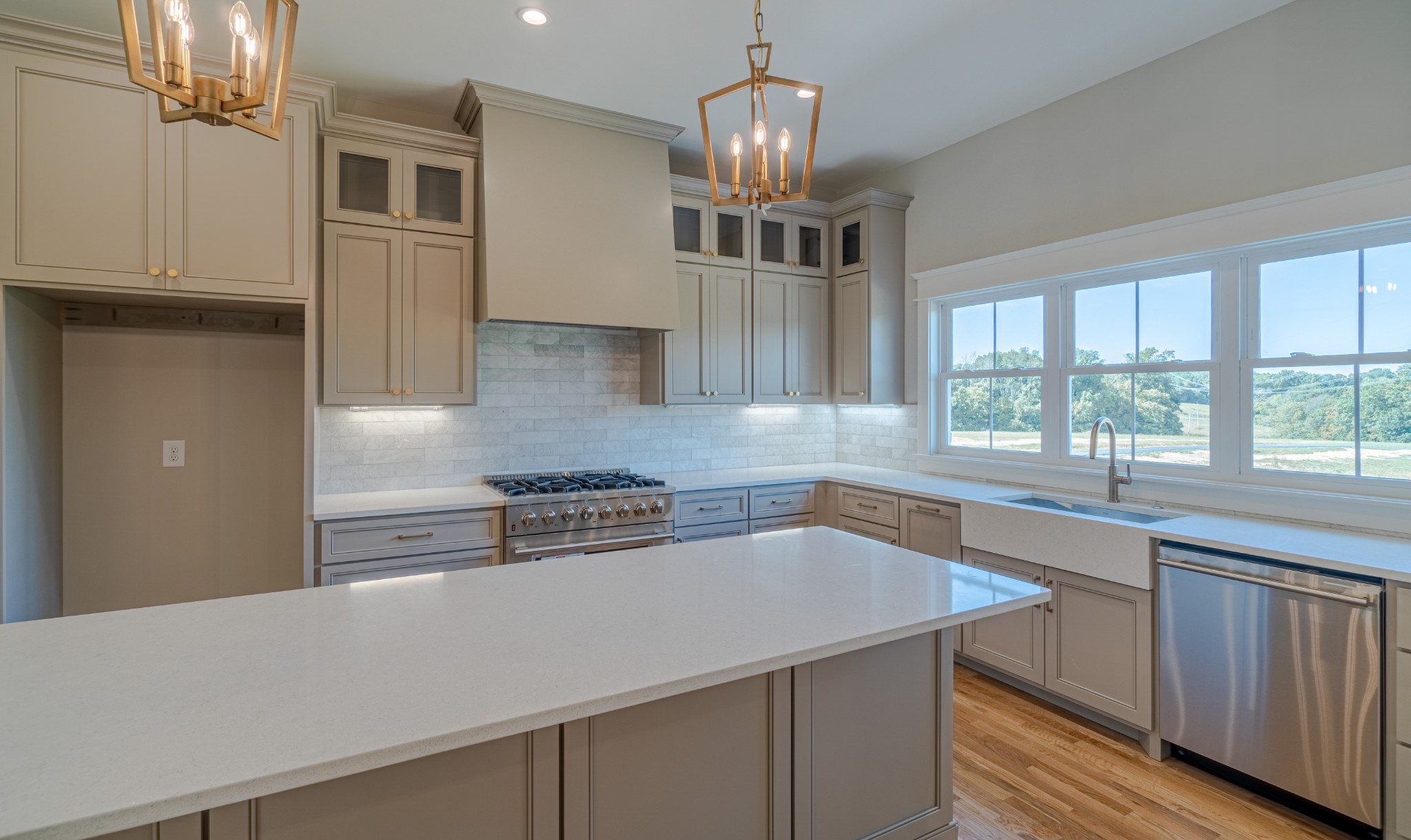 7039 Hall Road Greenbrier, TN 37073 - Photo 15 of 73 a kitchen with stainless steel appliances a counter top space cabinets and a window